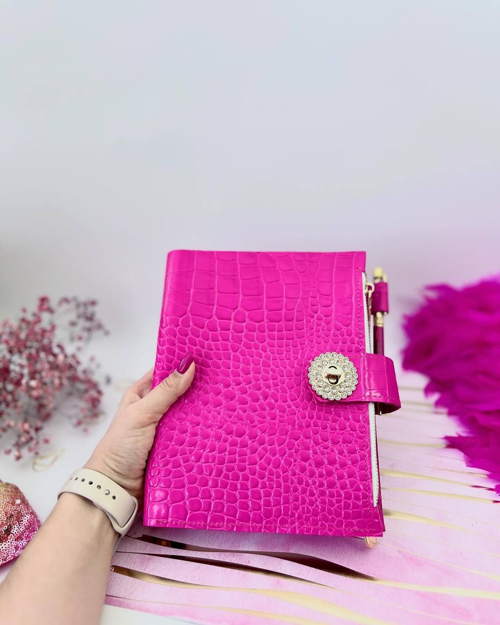 Cyprus, Limassol. Hot pink leather notebook cover A5 with big gold binder. Cover for A4 and A5 documents format.